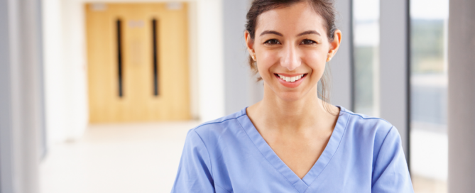 A caregiver looks happy as she looks forward to her career in home care!