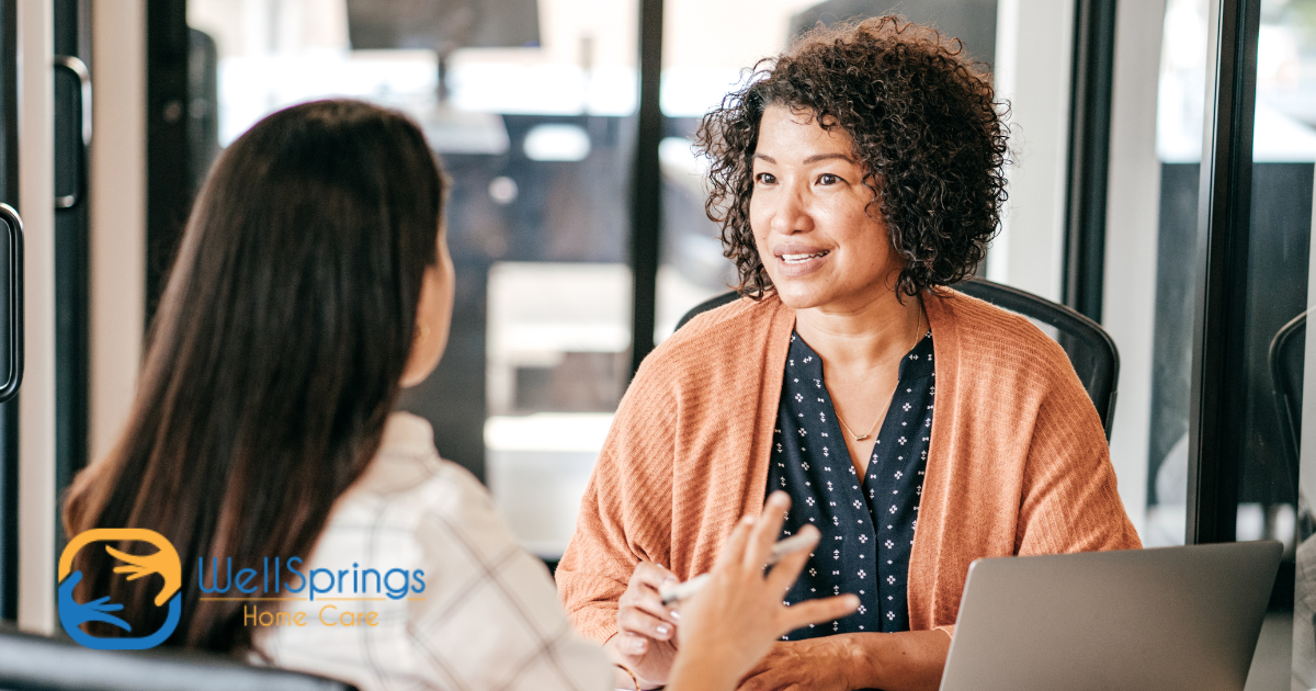 A woman interviews another woman for a caregiver job position.