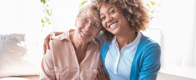 A caregiver enjoys professional caregiving as she helps a senior client.