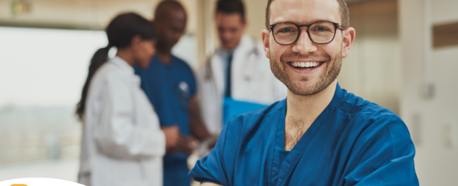 A young man in healthcare smiles, representing how a career as a professional caregiver can lead to a happy career as a healthcare professional.