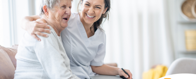 A professional caregiver embraces a senior client, showing the level of trust and comfort between them.